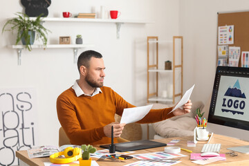 Male designer working in office