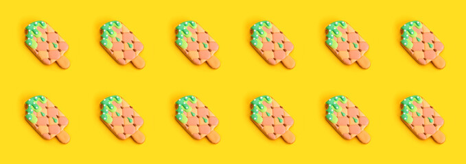 Colorful Ice cream pattern on yellow background иттук.  Summer concept. Flat lay.