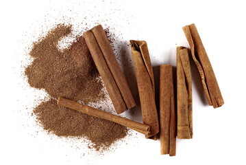 Cinnamon sticks with powder isolated on white background, top view
