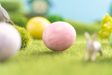 Easter egg outside in grass with evening sun from behind