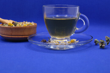 Tea with honey. Herbal harvest collection and bouquets of wild herbs. Alternative medicine. Natural pharmacy, self-care concept. Chamomile, Oregano, Thyme