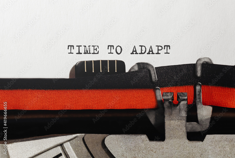 Fototapete text time to adapt typed on retro typewriter
