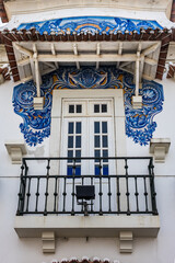 External view of Historic building of old Aveiro Railway station ornamented with typical blue azulejos tile exterior, which tells a story of life in traditional Portugal. Aveiro, Portugal.