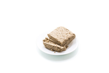piece of sweet halva on white background