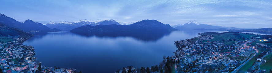 Weggis town, Switzerland. Lake Lucerne. Alps mountains in the snow. Aerial view.