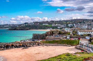 Fototapeta na wymiar View of St Ives, a seaside town and port in Cornwall, England. Once a fishing village, it is now primarily a popular seaside resort.