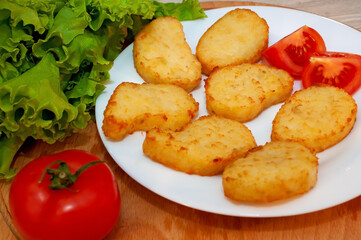 Oven potato pancakes and tomato