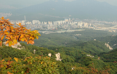 Autumn colors framing Seoul in South Korea as seen from Suraksan mountain