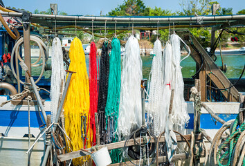 fishing floats and nets colored yellow and red called pots ideal for lake fishing © peuceta