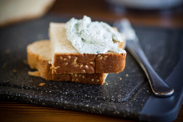 homemade salted curd spread with herbs and garlic