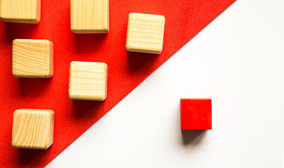 Wooden cubes of beige color. Individual approach to teaching concept. Leadership concept