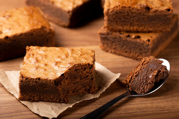 Chocolate brownie. Spoon with piece of chocolate brownie.
