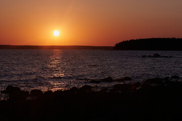Beautiful sunset on the Gulf of Finland. Typical northern summer landscape.