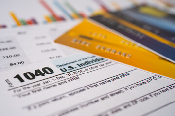 Obraz premium Tax Return form 1040 and dollar banknote, U.S. Individual Income.