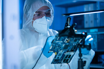 Microelectronics engineer works in a modern scientific laboratory on computing systems and...