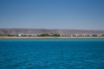 Fototapeta premium Red sea coral reef and blue sky. El Gouna, Egypt