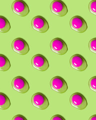 Food pattern with yolks on green background