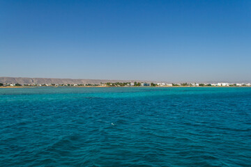 Red sea coral reef and blue sky. El Gouna, Egypt