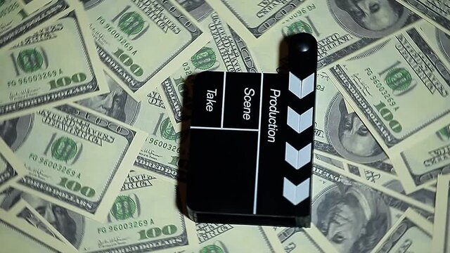 footage of clapper board money background 
