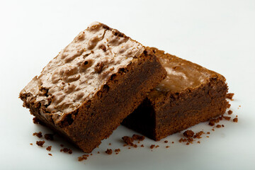 Delicious pieces of fresh brownie on white background. Chocolate pie.