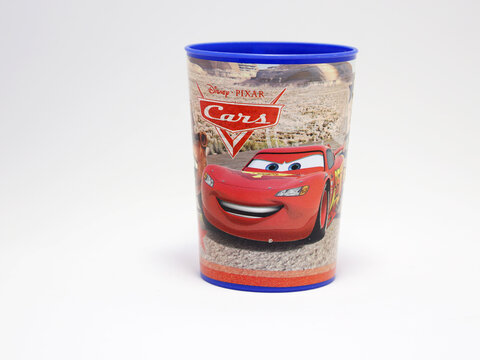 Cars. Lightning MCQUEEN and Crane Mate. Glasses with the characters from the movie Cars. Tow Mate Mater. Pixar Cars movie. Red car. Number 95. Rust-eze. Isolated white. Front view.