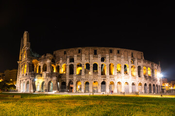 Fototapeta na wymiar Ruins of the ancient Colosseum at night, Rome, Italy