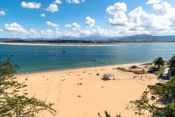 Beach of Los Peligros in the Bay of Santander in Spain. Sunny day of summer.