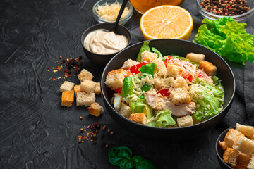Culinary background with salad, crackers and sauce on a dark background.