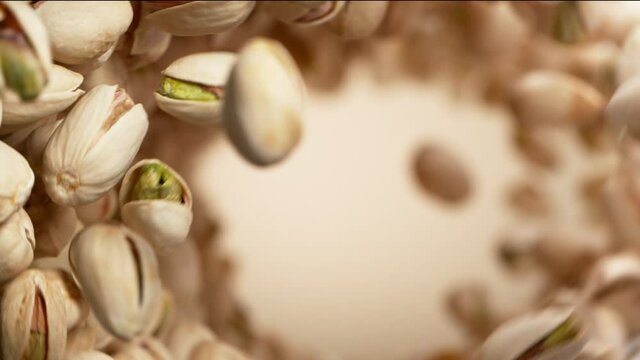 Super slow motion of flying pistachios in rotating movement. Filmed on high speed cinema camera, 1000fps.