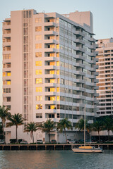 buildings downtown Miami Florida urban apartments real state house exterior boat sea vertical 