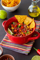 Chili con carne with nachos chips. Mexican food. National cuisine.