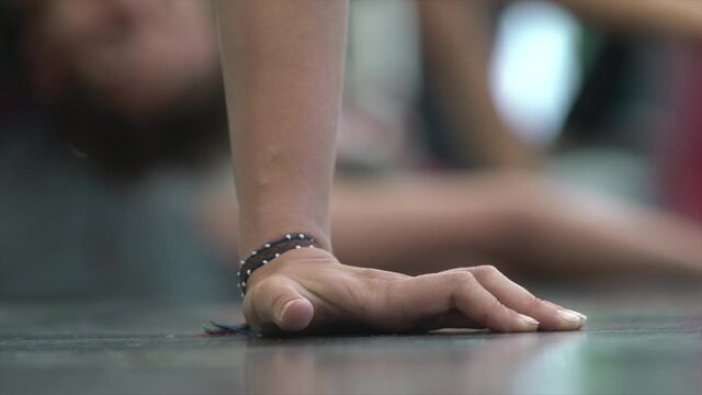 dancer close-up palm rests on the floor 50fps HFR