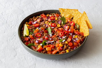 Chili con carne with nachos chips. Mexican food. National cuisine.