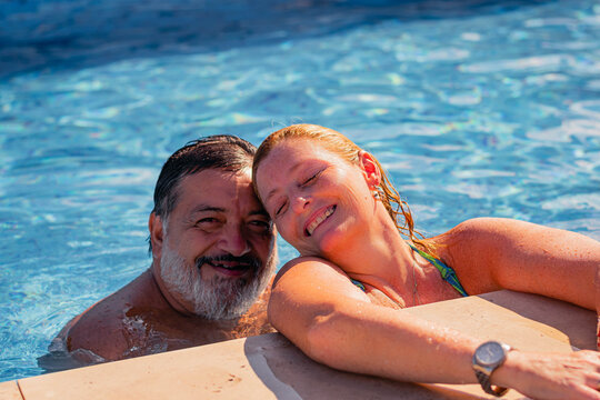 Couple Of Two Adults In Swimming Pool