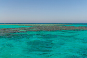 Red sea coral reef and blue sky. El Gouna, Egypt