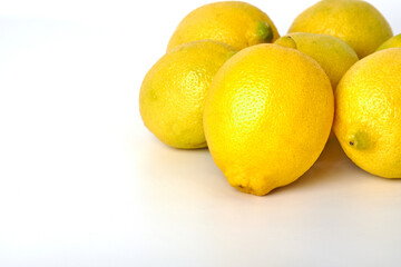 Rich and healthy lemons on white background