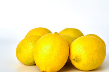 Rich and healthy lemons on white background