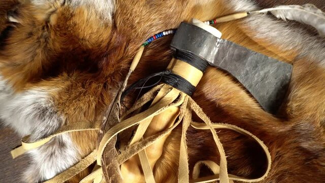 Tomahawk with Fox Coat on wooden Table - Background