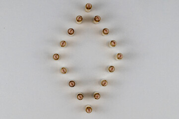 5.56mm bullets arranged in the shape of a diamond lit from both sides