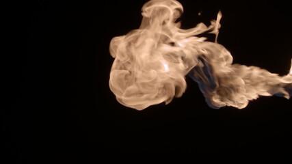 Slow-motion video of fire and flames. A fire pit, burning gas or gasoline burns with fire and flames. A hellish glow of fire in the dark with copy space