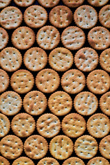 Snack cookie cracker pattern on black background