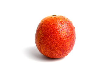 Red ripe orange with dew drops on the peel.
