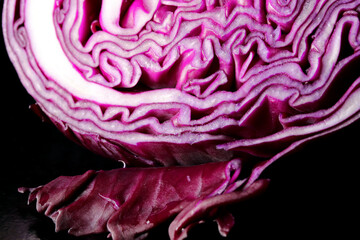 close-up red cabbage on black background