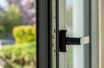 Aluminum window open detail. Metal door frame closeup view. © Rawf8