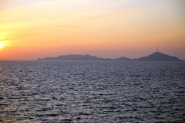 Shadows and colors of the sunset over the sea and the islands of the If archipelago, Parc National des Calanques, Marseille, France