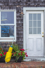 USA, Massachusetts, Cape Ann, Gloucester. Door with lobster buoys.