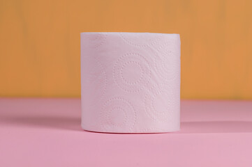 Roll of toilet paper on a colored background