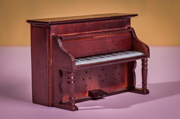 Old wooden piano from a dollhouse