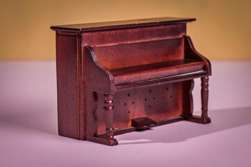 Old wooden piano from a dollhouse