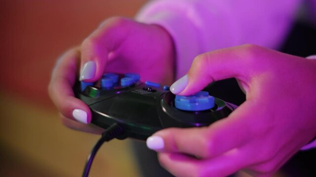 Young lady is playing a computer games